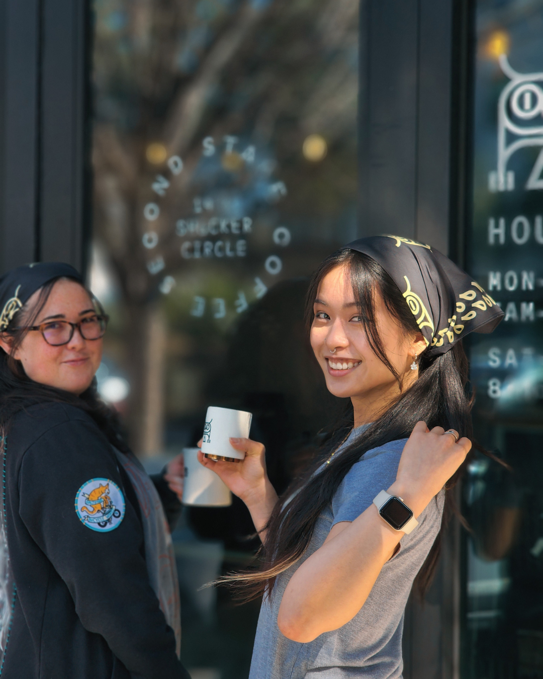 baristas outside second state coffee shop wearing black and cream second state bandanas