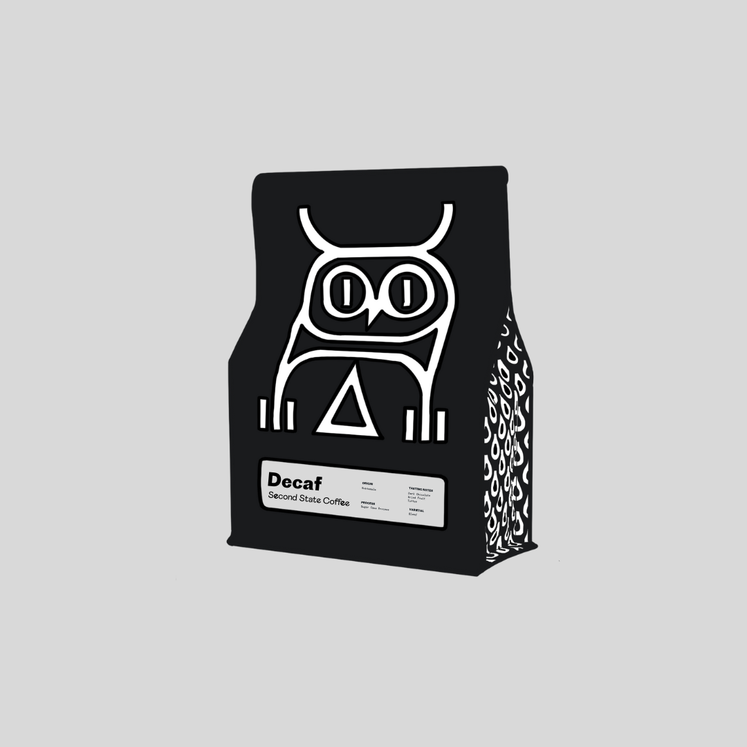 Decaf coffee bag text description reads origin risaralda, Colombia. process: sugar cane. tasting notes: dark chocolate, berries, toffee. variety: blend