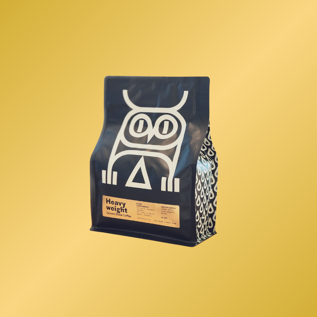 Medium Roast coffee blend label heavyweight bold and chocolatey from Colombia and Brazil with notes of Granny Smith, fudge brownie, and walnut