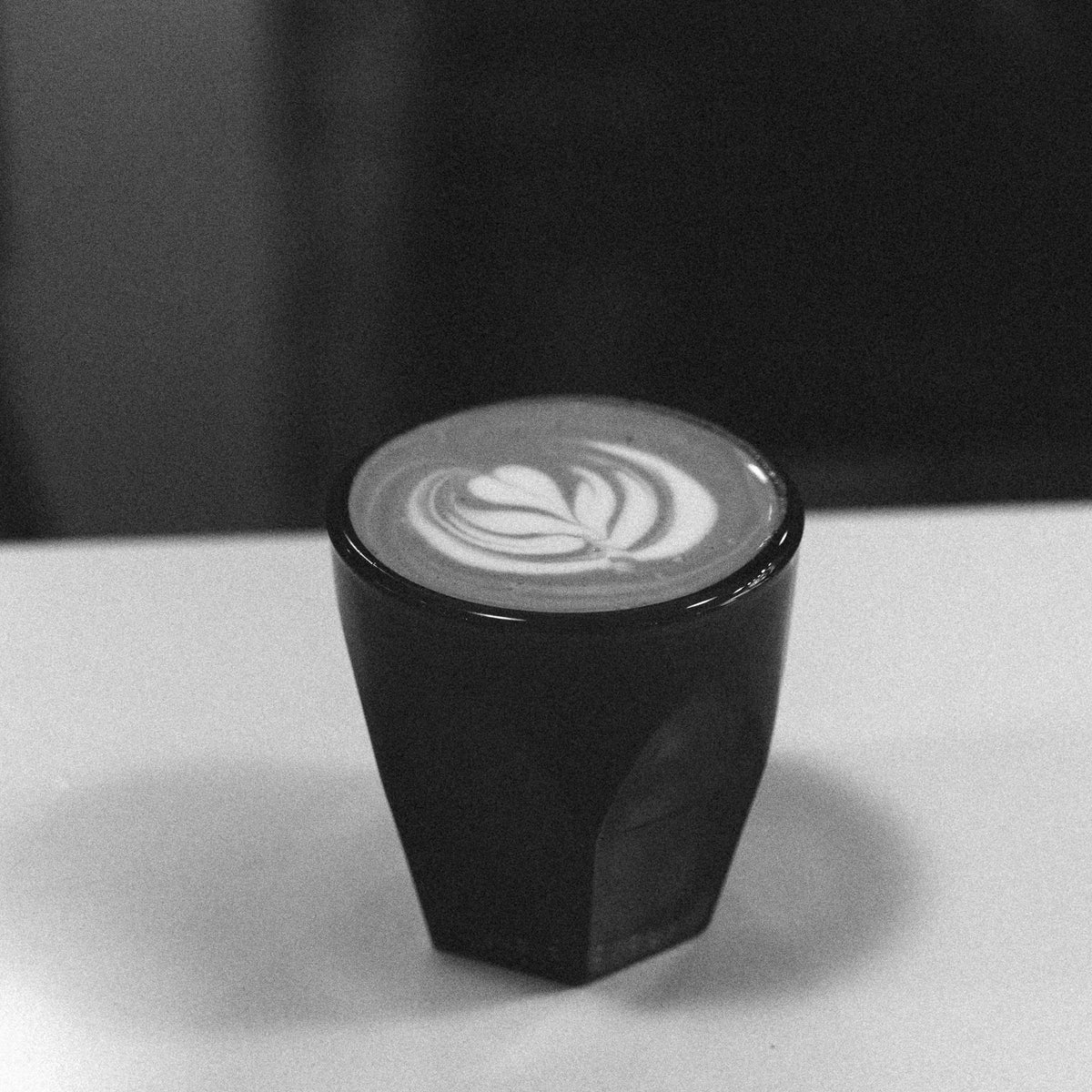 cortado featured close up with latte art. learn to make espresso drinks and steam milk in home barista espresso class